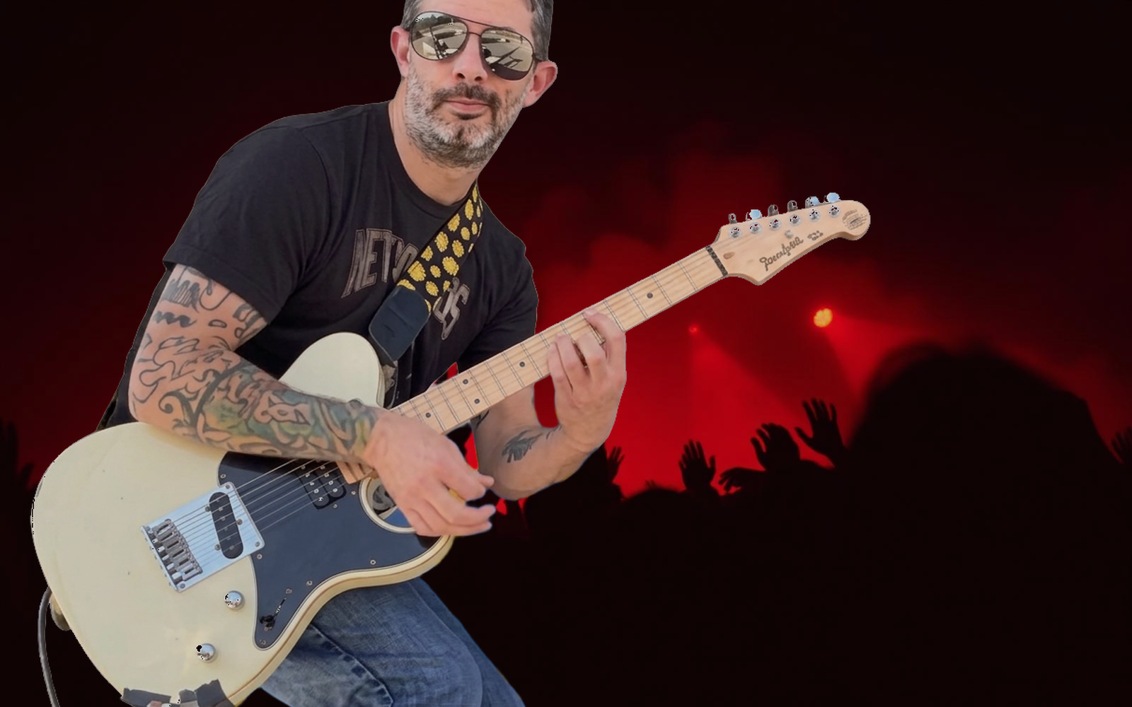 Mike Donnelly performing live with guitar